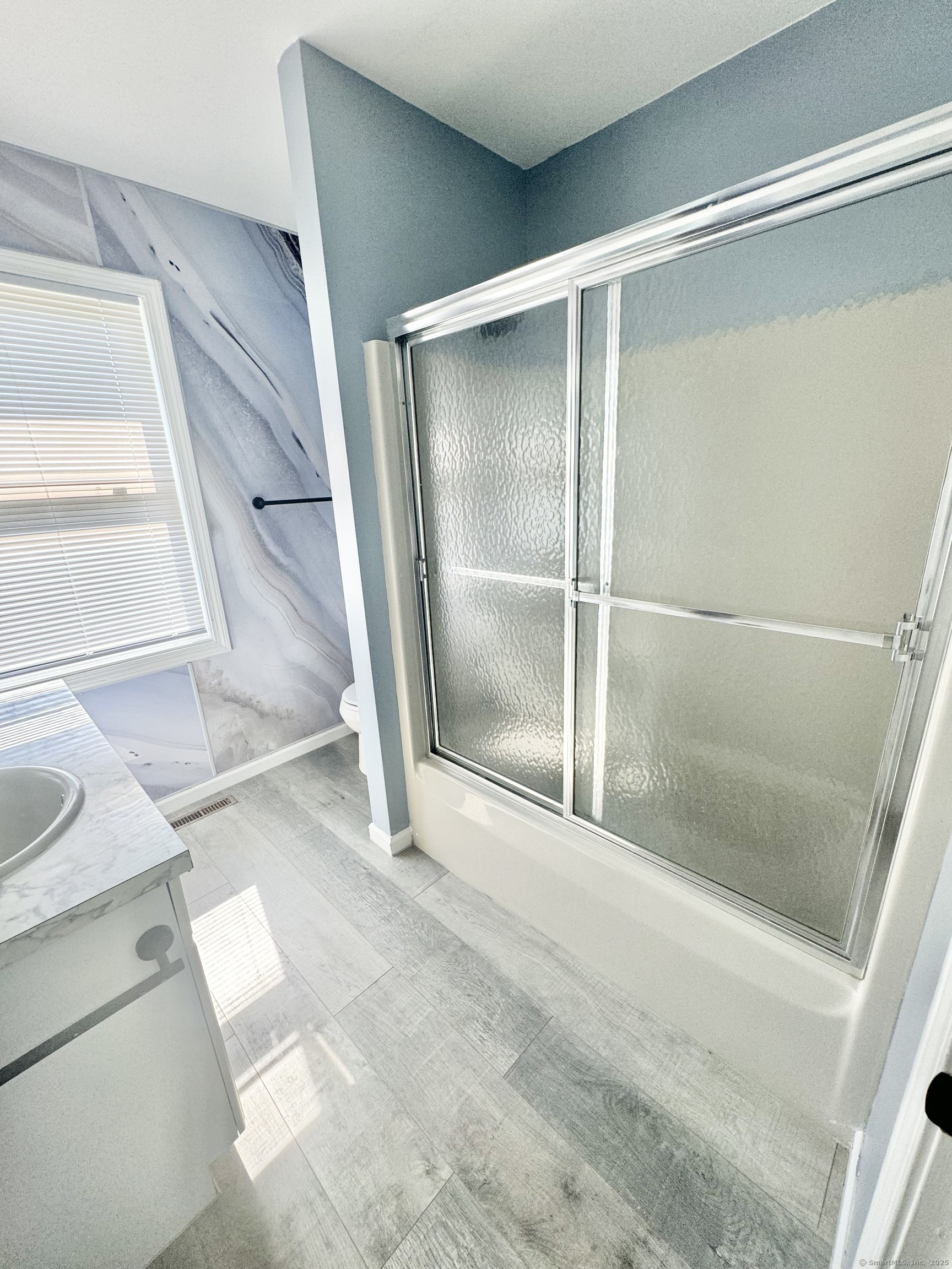 116 Dunbar Lane, Unit 2 Hamden, CT 06514 - Photo 15 of 22 a bathroom with a shower and a tub