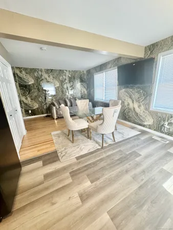 a view of living room filled with furniture and a table