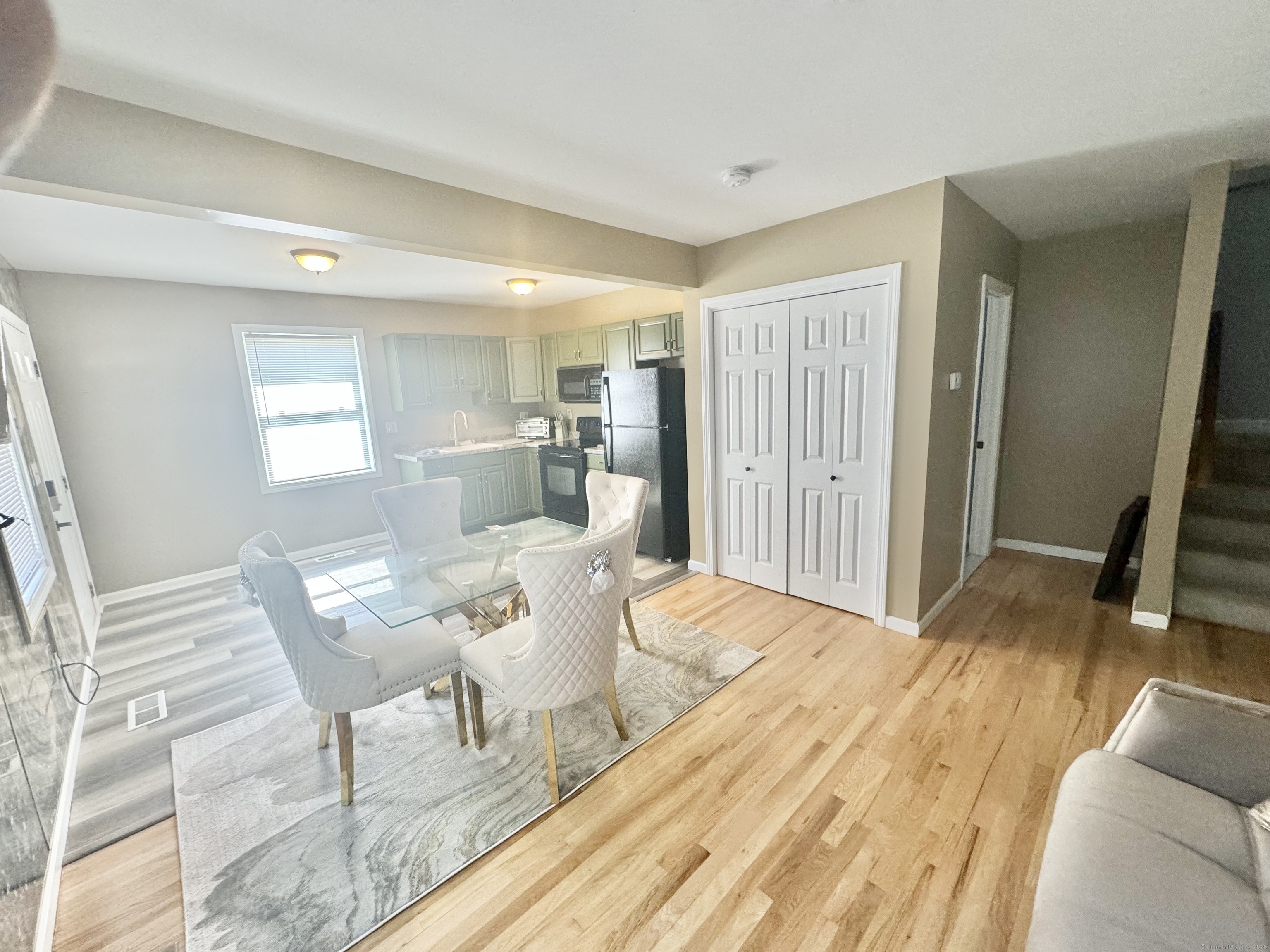 116 Dunbar Lane, Unit 2 Hamden, CT 06514 - Photo 10 of 22 a view of a livingroom with furniture and wooden floor
