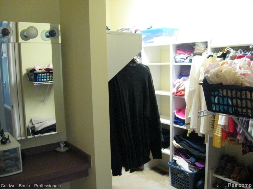3917 Hosner Road Dryden, MI 48428 - Photo 32 of 43 Master bedroom, walk-in closet, with makeup vanity.