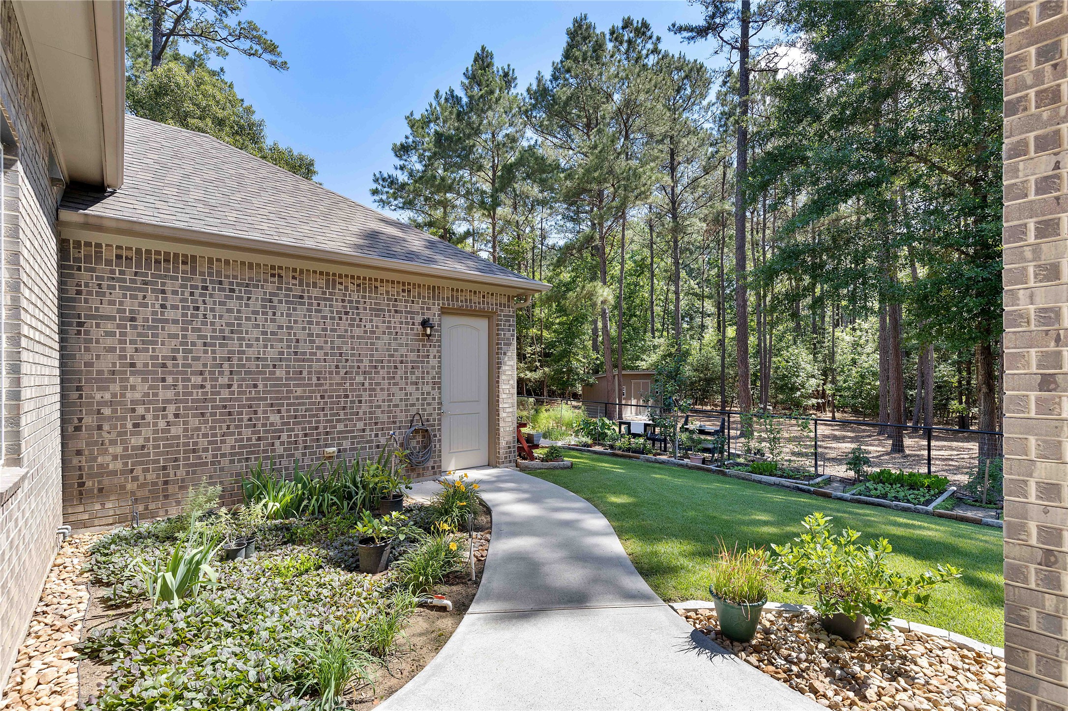 166 Rim Rock Road Huntsville, TX 77340 - Photo 37 of 50 Walkway to garage/work area