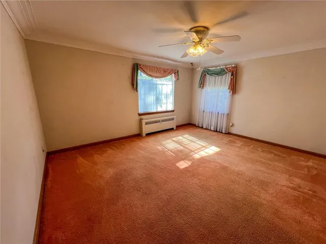a view of an empty room with stairs