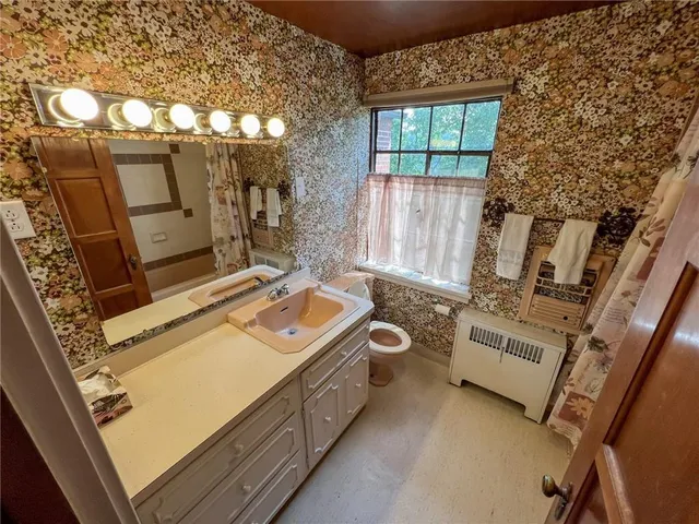 a view of a house with a yard and garage