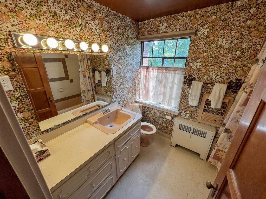 605 Center Street Emlenton, PA 16373 - Photo 34 of 47 a view of a kitchen with wooden floor and electronic appliances