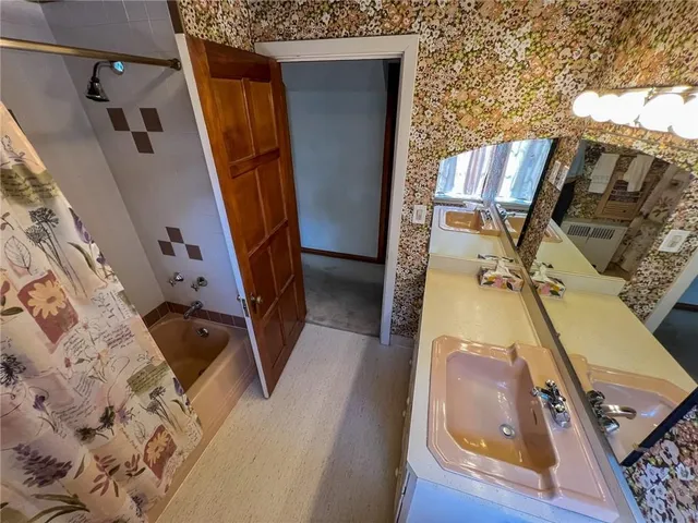 a view of a house with a yard and garage