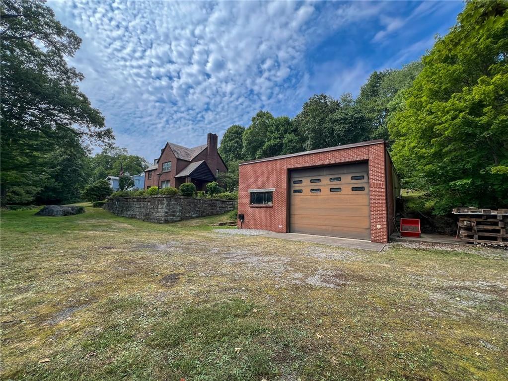 605 Center Street Emlenton, PA 16373 - Photo 45 of 47 a front view of a house with a yard and garage