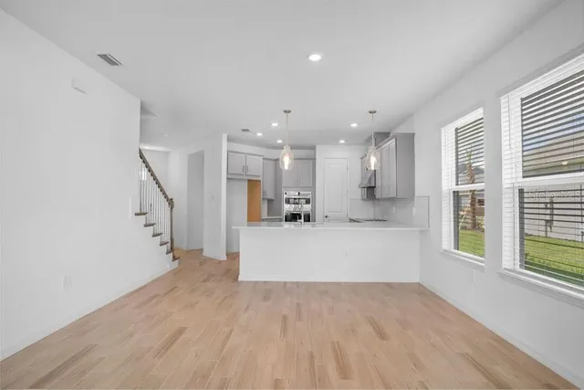 a view of a living room and windows