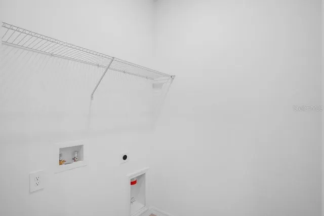 a view of a room with racks on the wall