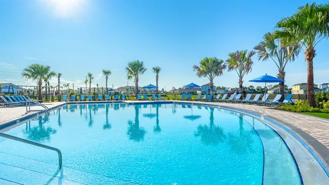 a view of a lake with a table and chairs
