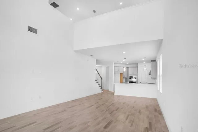 a view of a kitchen with a sink and cabinets