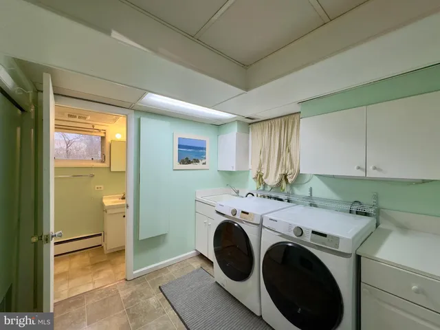 a utility room with dryer and washer
