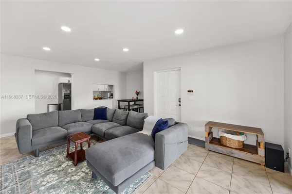 a living room with furniture and a couch