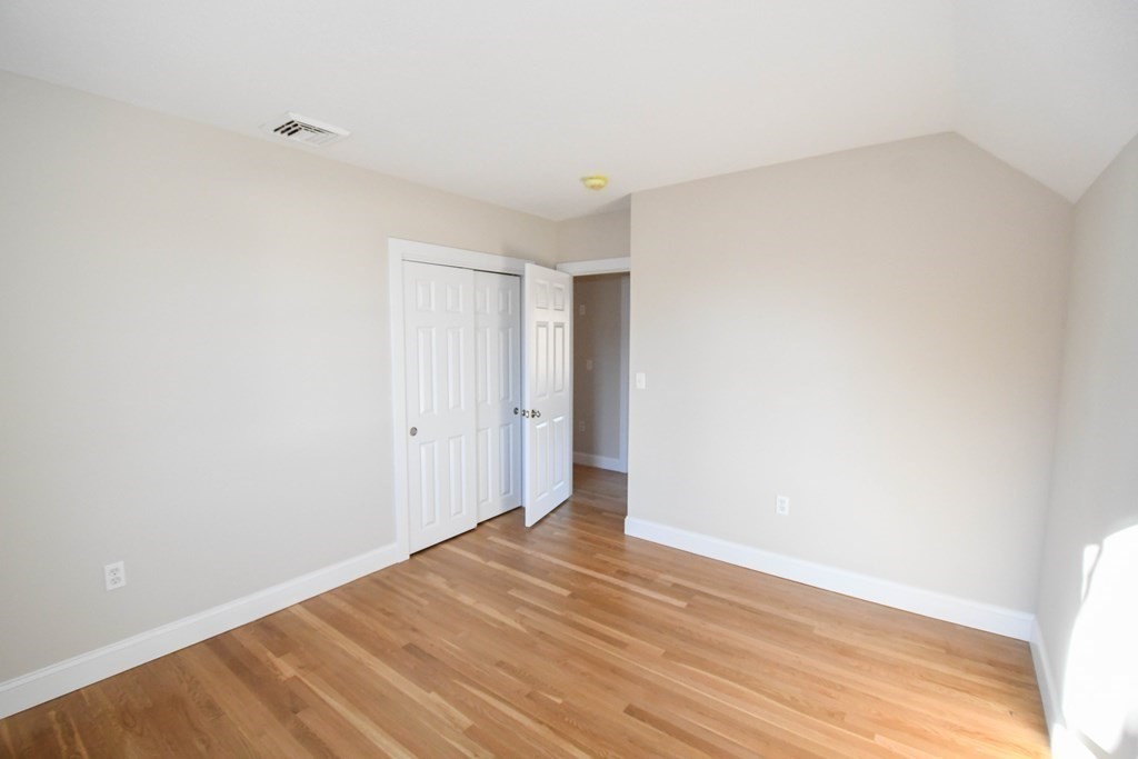 286 Wheeler Road Dracut, MA 01826 - Photo 20 of 32 a view of an empty room with wooden floor