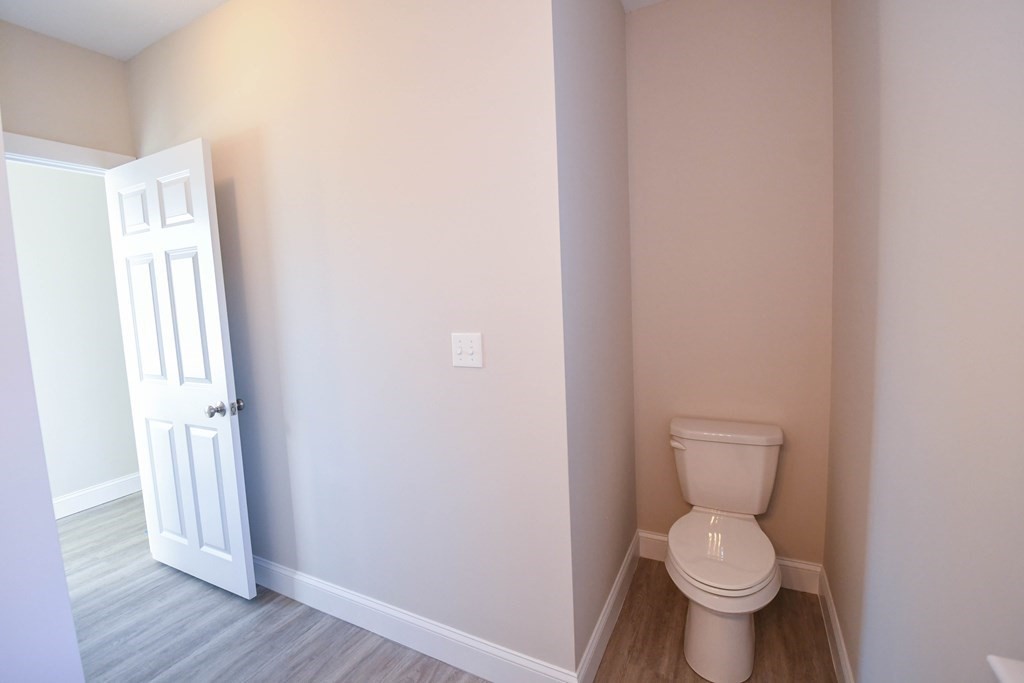 286 Wheeler Road Dracut, MA 01826 - Photo 28 of 32 a a bathroom with a toilet and a window