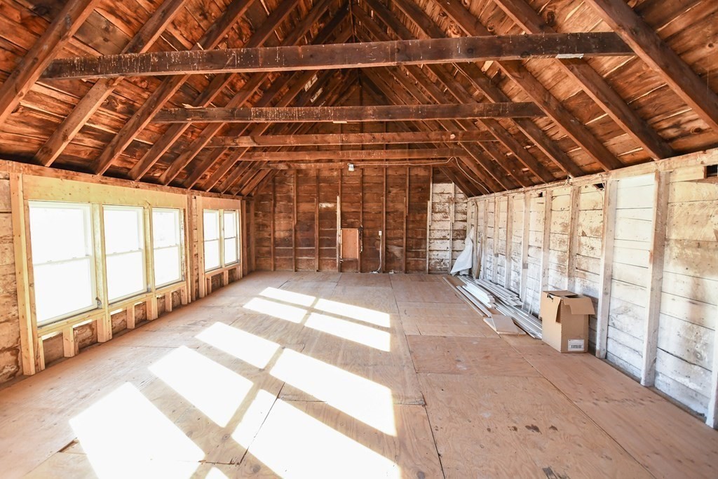 286 Wheeler Road Dracut, MA 01826 - Photo 30 of 32 a view of an empty room with a balcony
