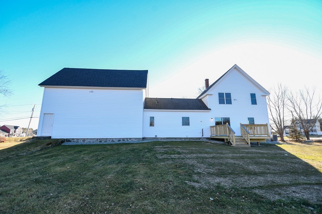 286 Wheeler Road Dracut, MA 01826 - Photo 4 of 32 a front view of a house with a yard