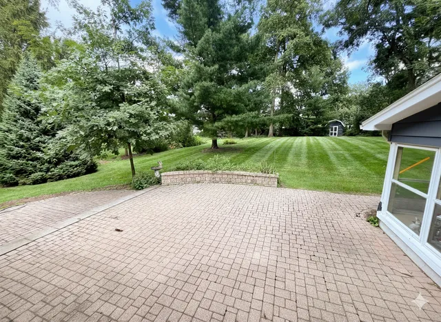 a view of backyard with green space