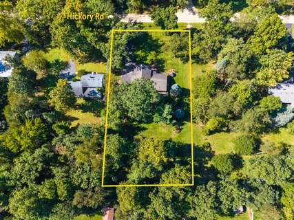 an aerial view of residential houses with trees