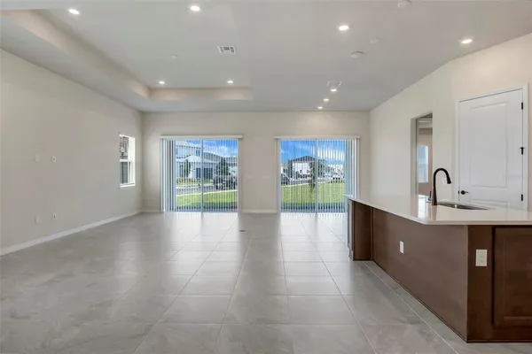 a view of a kitchen with furniture and a window