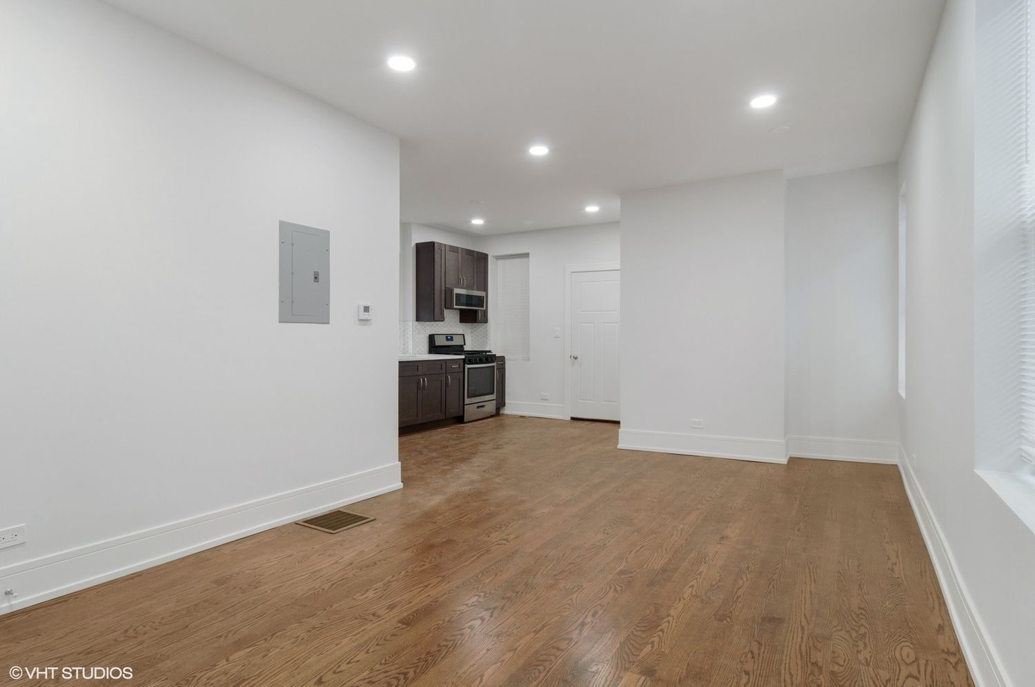 1719 West 18th Street, Unit 2R Chicago, IL 60608 - Photo 5 of 8 a view of a kitchen with a sink and a refrigerator