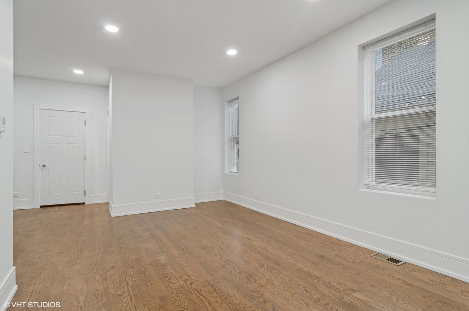 1719 West 18th Street, Unit 2R Chicago, IL 60608 - Photo 7 of 8 a view of an empty room with wooden floor and a window