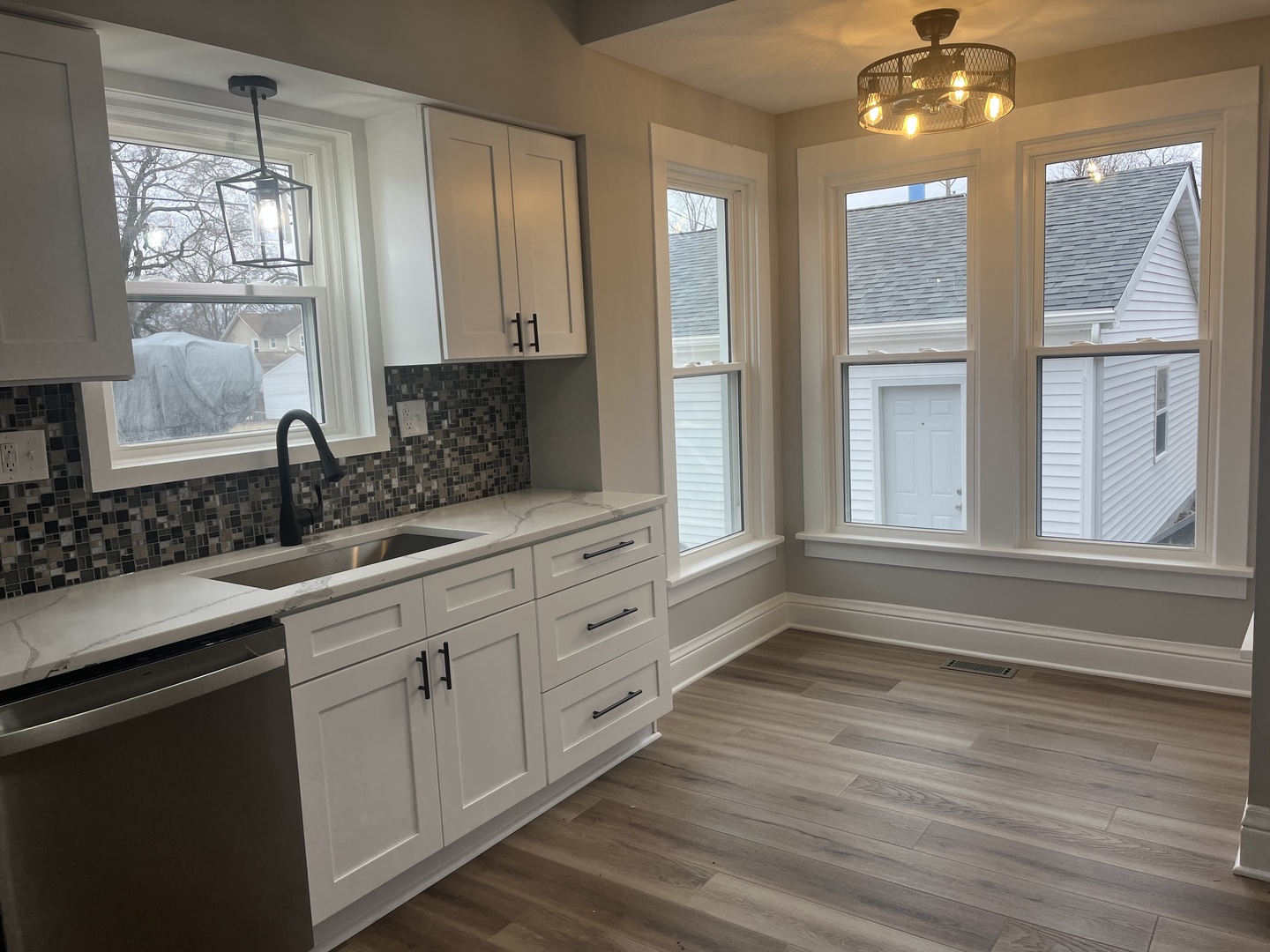 125 South Main Street Clifton, IL 60927 - Photo 23 of 30 a bathroom with a double vanity sink a mirror and a bathtub
