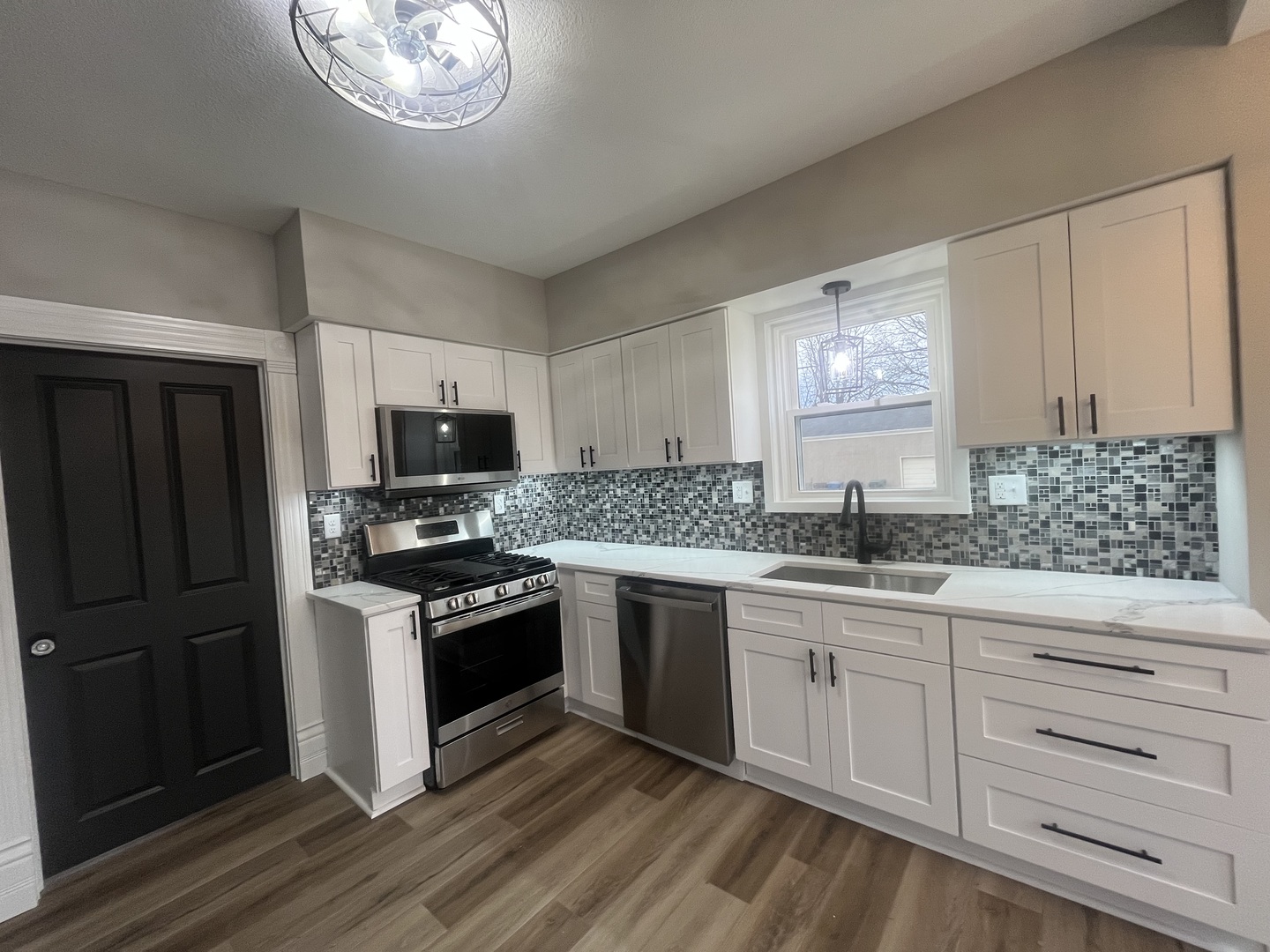 125 South Main Street Clifton, IL 60927 - Photo 9 of 30 a kitchen with granite countertop cabinets stainless steel appliances and a counter space