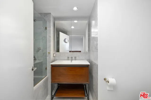 a bathroom with a sink and a mirror