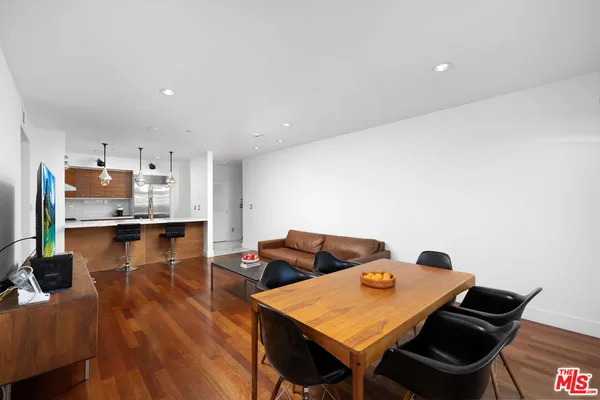 a view of kitchen with dining table and chairs