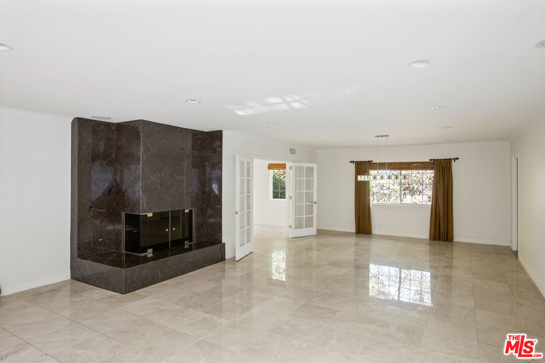 16636 Calneva Drive Encino, CA 91436 - Photo 4 of 19 a view of an empty room and window