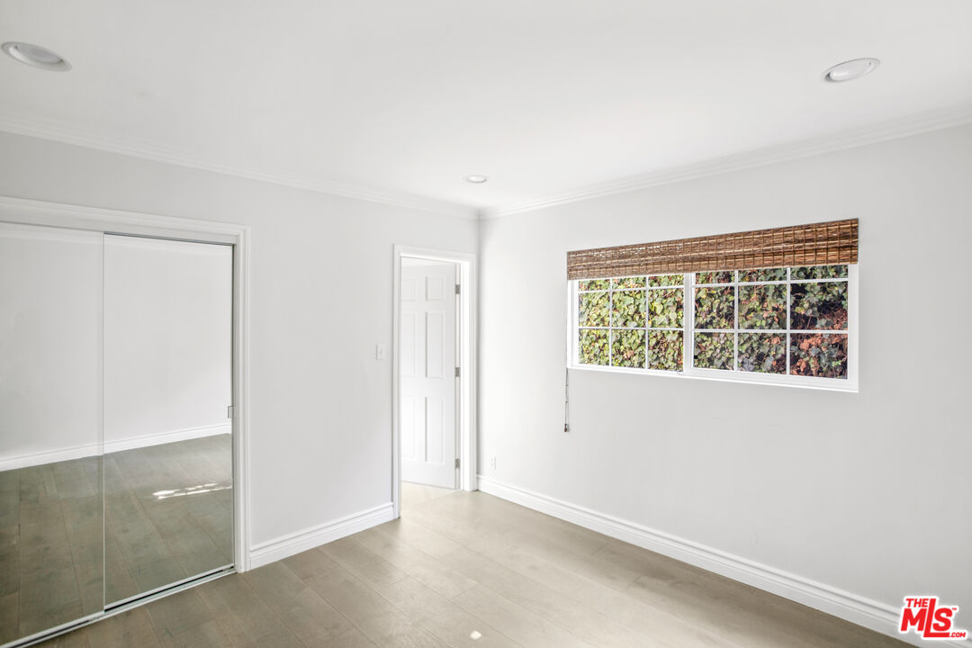 16636 Calneva Drive Encino, CA 91436 - Photo 8 of 19 an empty room with windows