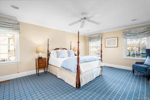 a bed room with a bed and a chandelier