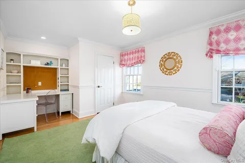 a bedroom with a bed and furniture