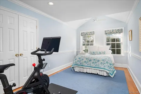 a bedroom with bed and a window