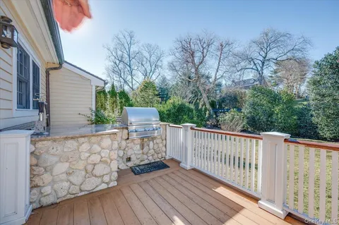 a view of deck with wooden floor and fence