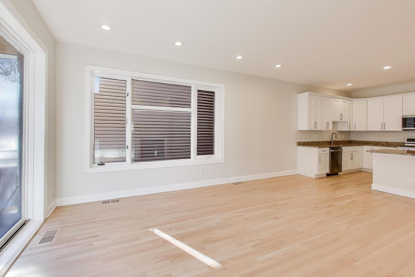 1920 North Springfield Avenue, Unit 1S Chicago, IL 60647 - Photo 11 of 36 a view of an empty room with a window