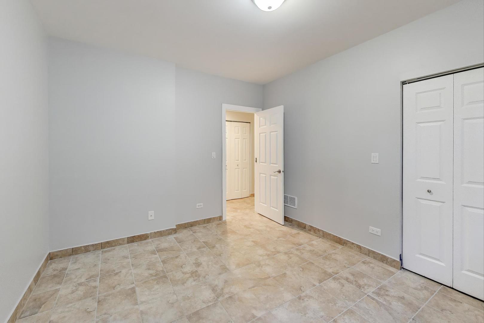 1920 North Springfield Avenue, Unit 1S Chicago, IL 60647 - Photo 32 of 36 an empty room with an entryway