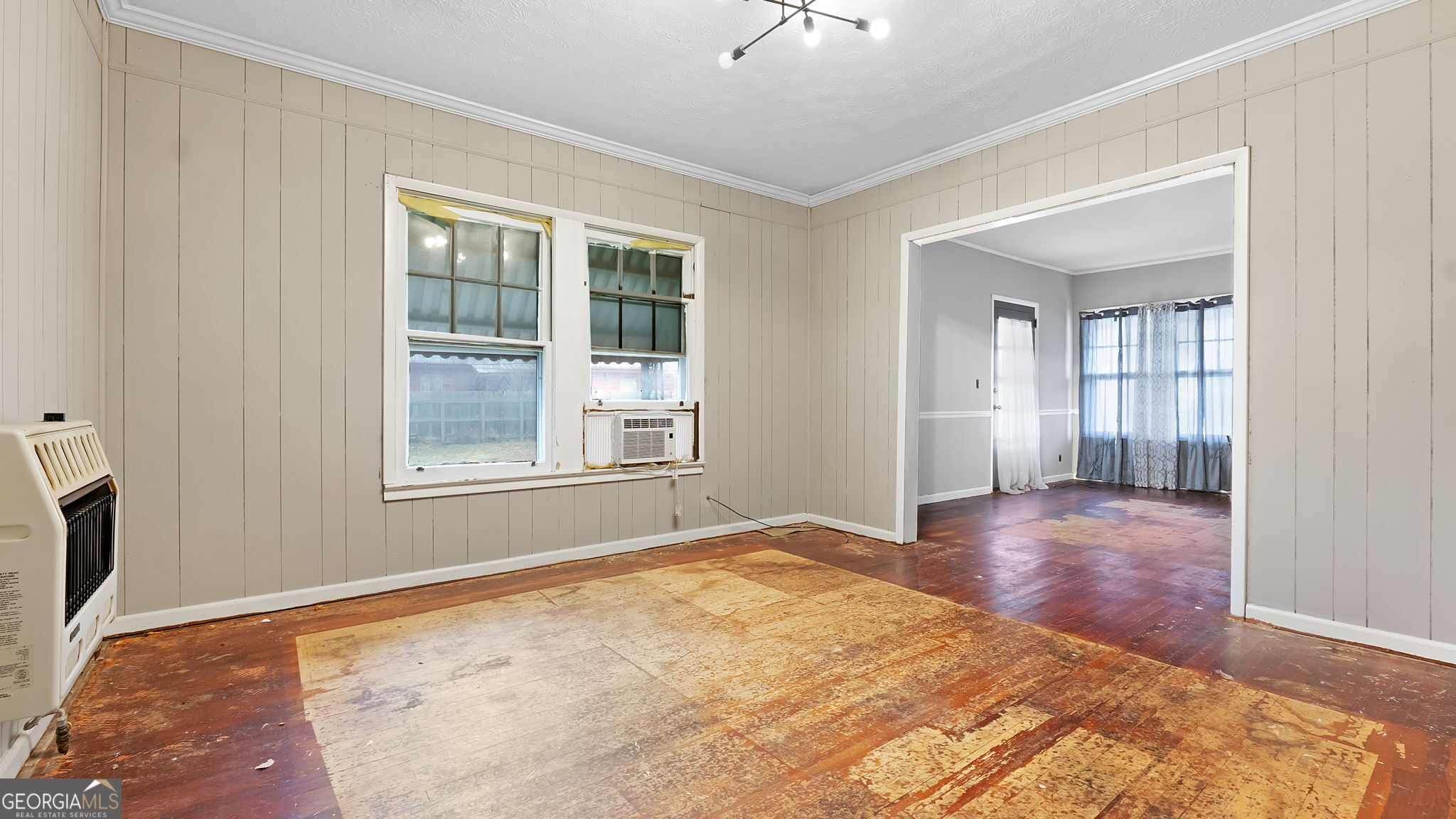 110 Bevis Circle Bowdon, GA 30108 - Photo 11 of 26 a view of an empty room with wooden floor and a window
