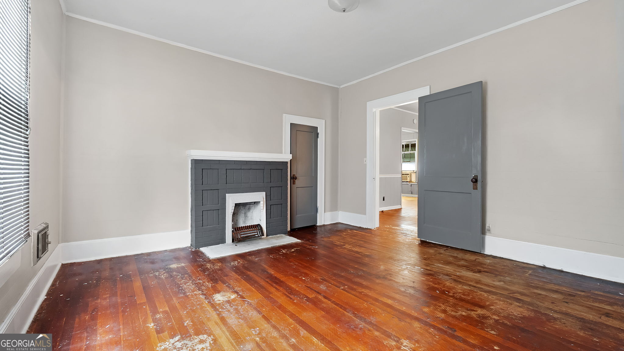 110 Bevis Circle Bowdon, GA 30108 - Photo 16 of 26 a view of an empty room with wooden floor fireplace and a window