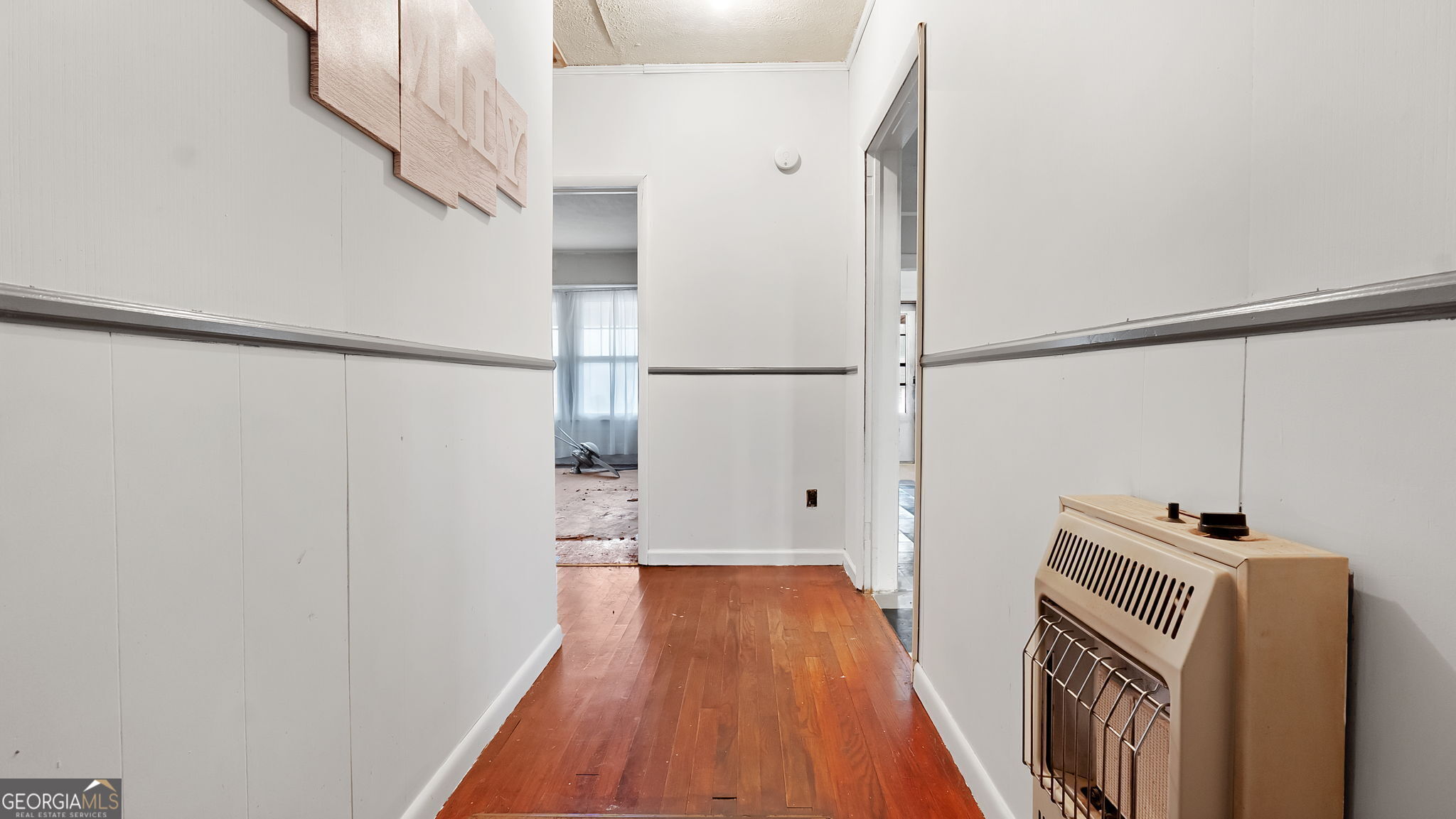 110 Bevis Circle Bowdon, GA 30108 - Photo 23 of 26 a view of hallway with wooden floor
