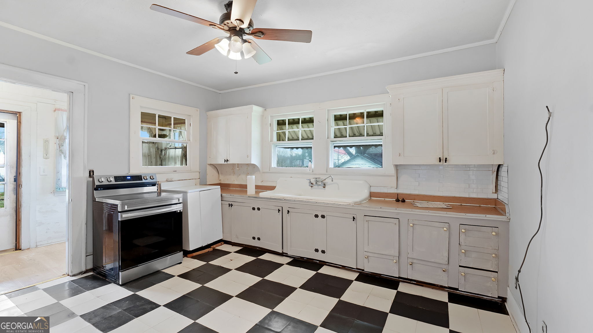 110 Bevis Circle Bowdon, GA 30108 - Photo 24 of 26 a kitchen with a sink stove and cabinets