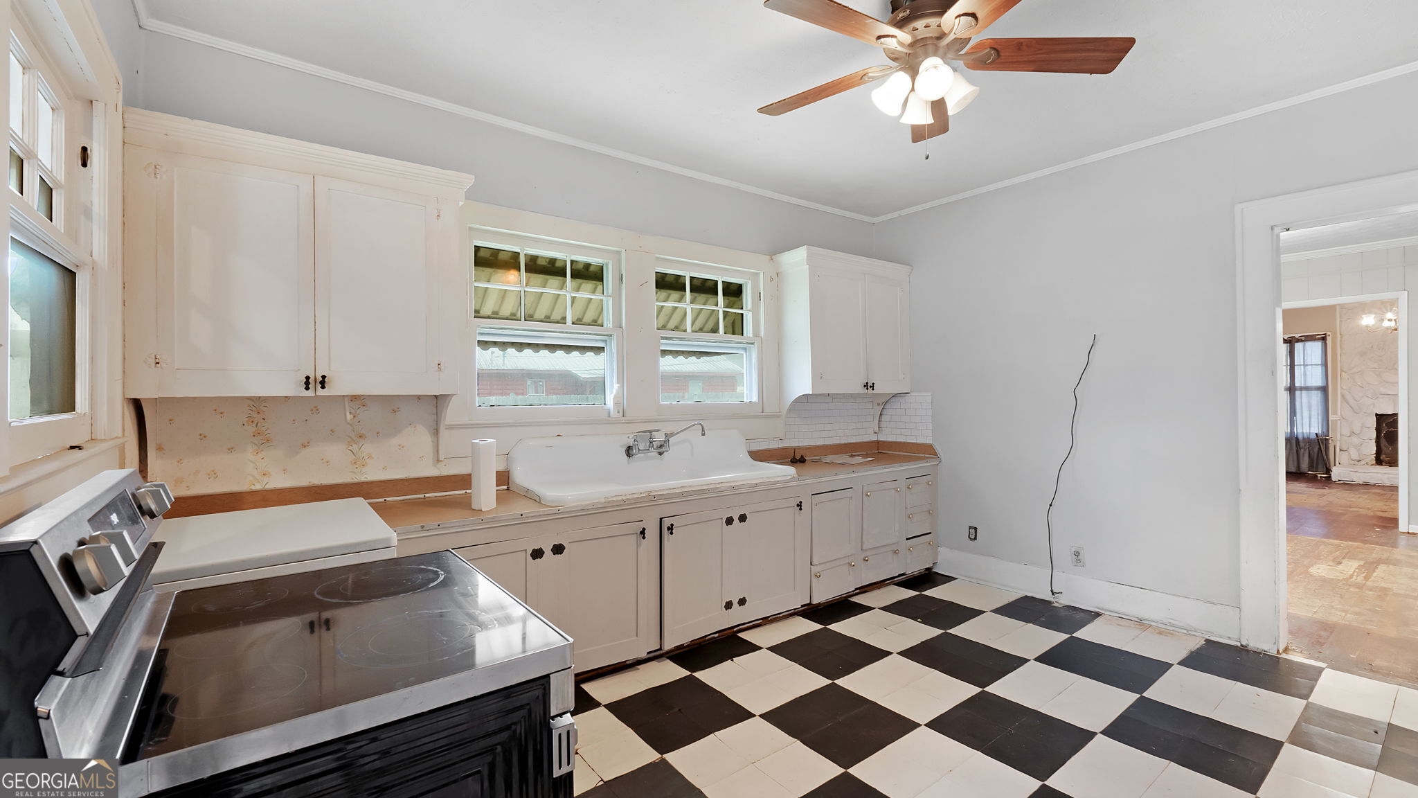 110 Bevis Circle Bowdon, GA 30108 - Photo 25 of 26 a kitchen with a sink a stove and a refrigerator