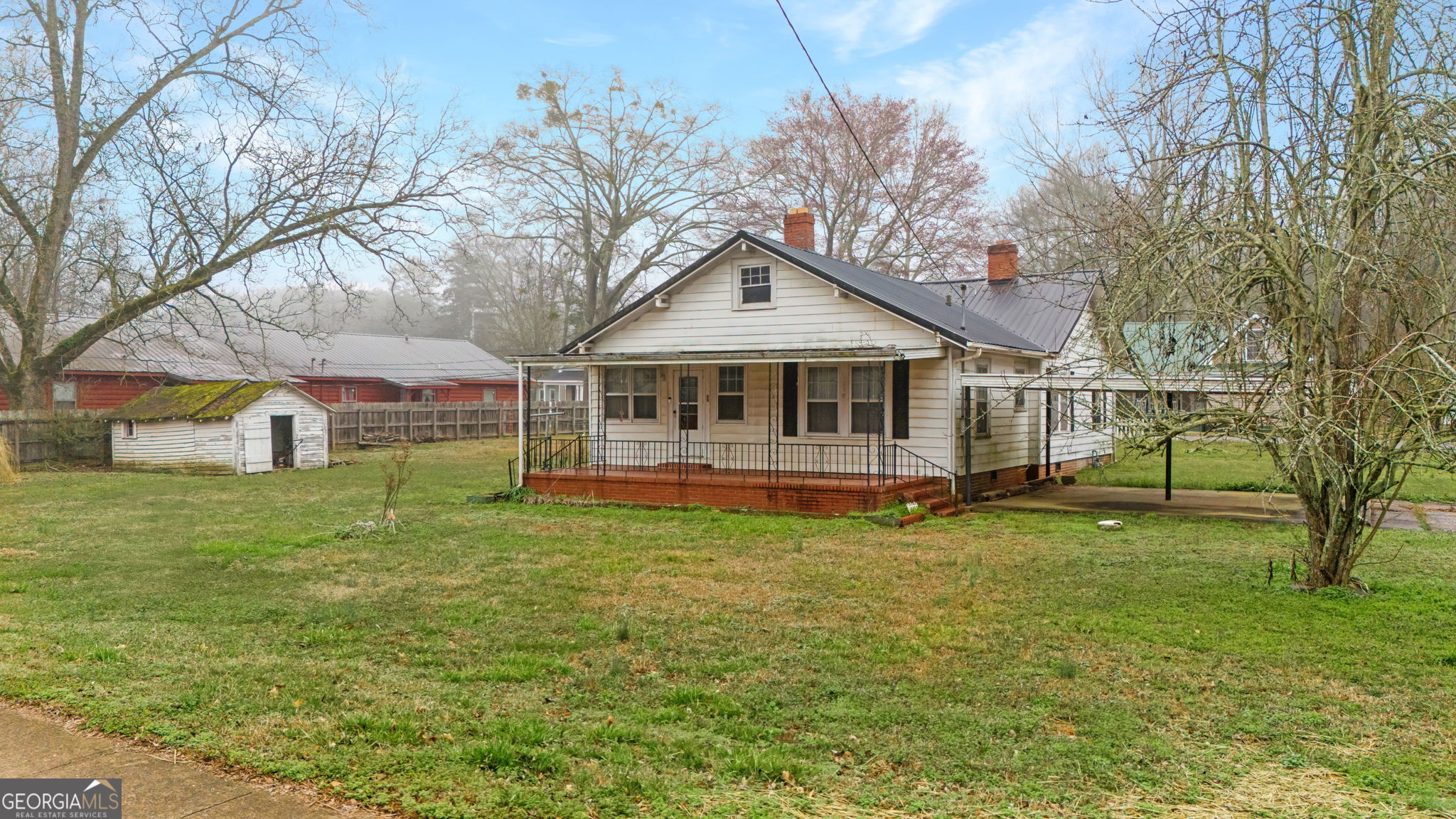 110 Bevis Circle Bowdon, GA 30108 - Photo 3 of 26 a backyard of a house with table and chairs