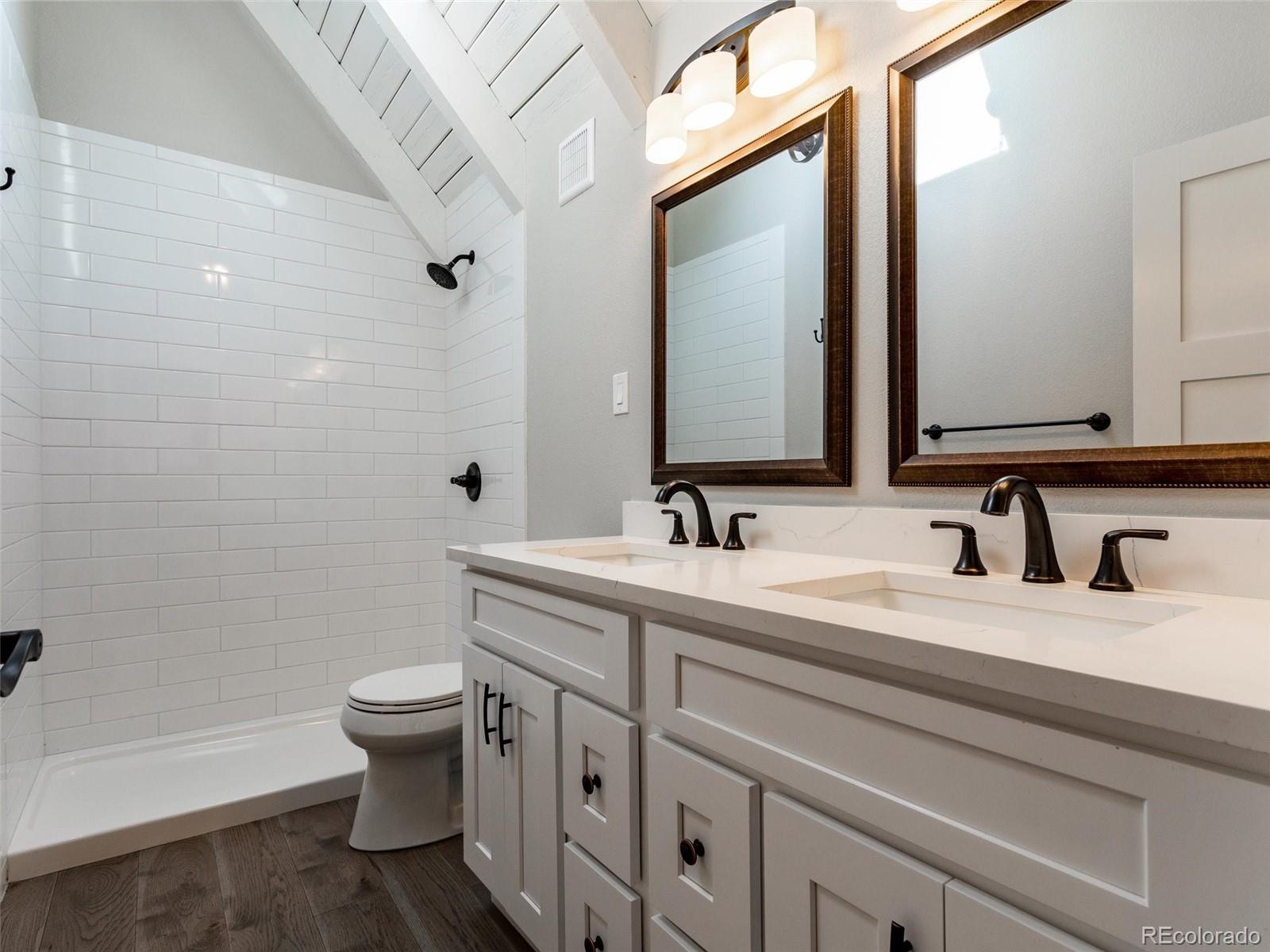 442 Deer Trail Road Boulder, CO 80302 - Photo 17 of 40 a bathroom with a toilet sink and mirror