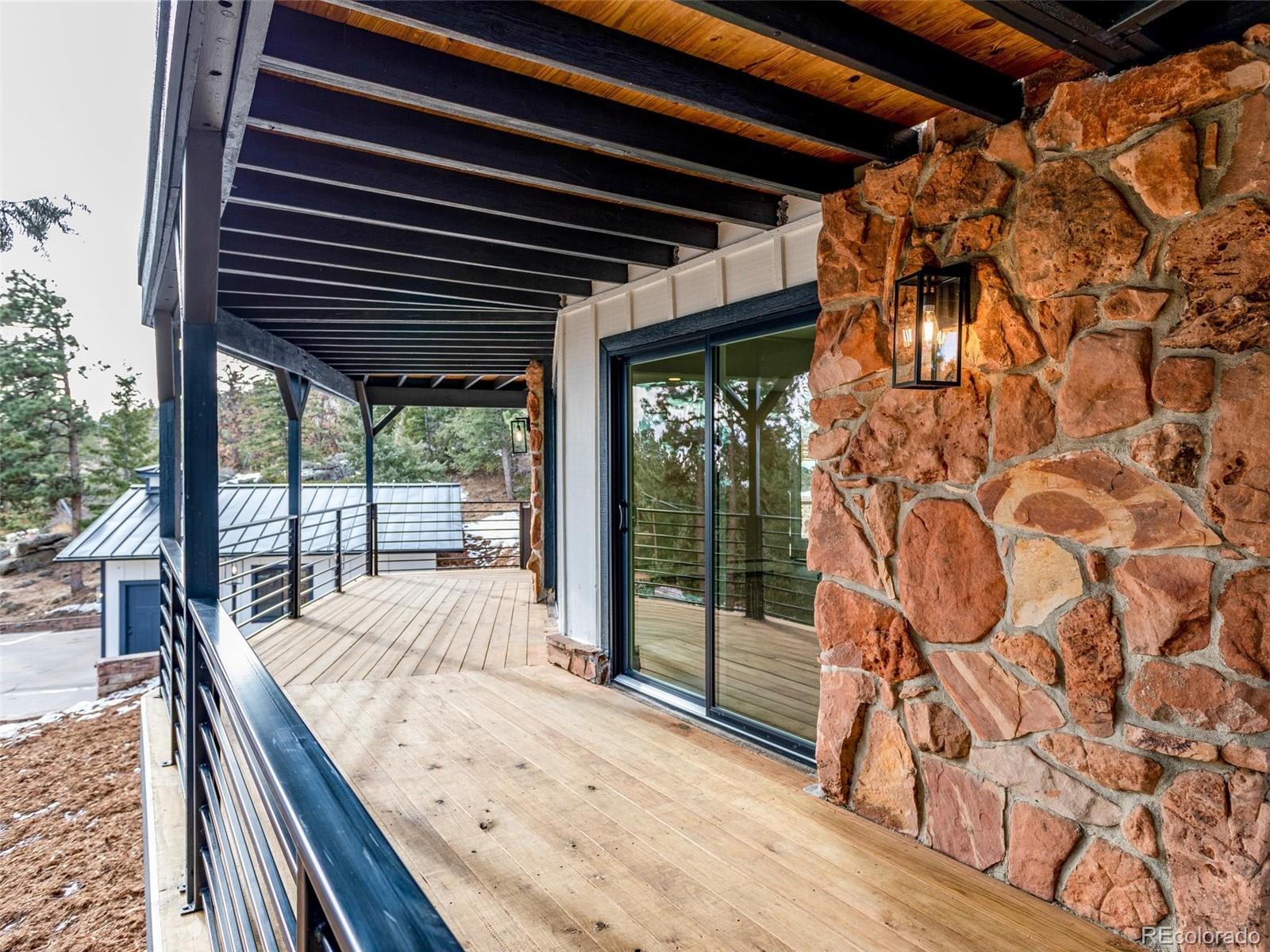 442 Deer Trail Road Boulder, CO 80302 - Photo 29 of 40 a view of backyard with window and wooden floor