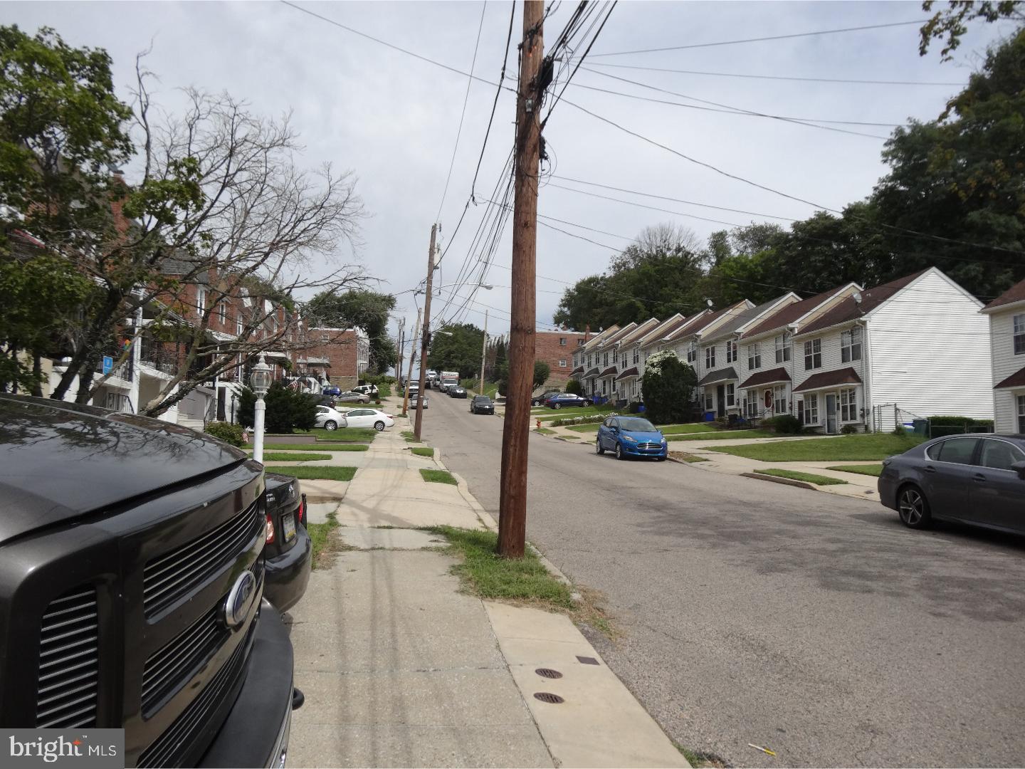 a view of street with parked cars