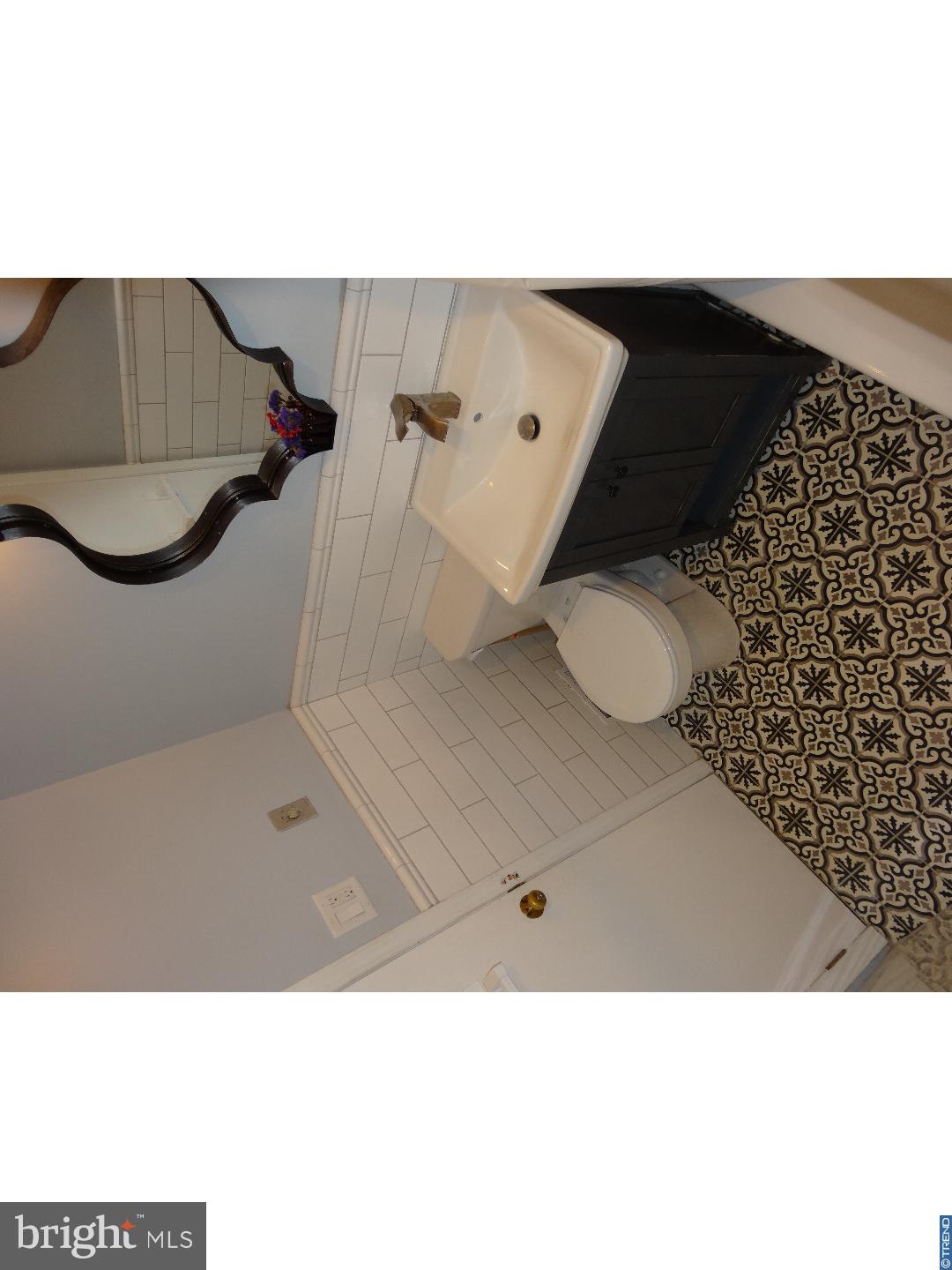 310 Ripka Street Philadelphia, PA 19128 - Photo 11 of 14 a bathroom with a sink and a toilet
