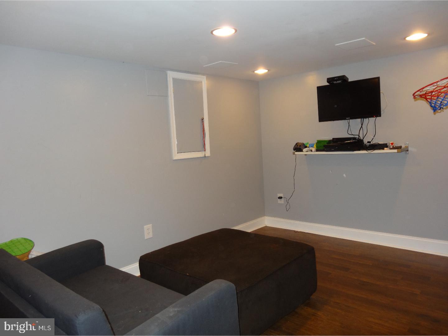 310 Ripka Street Philadelphia, PA 19128 - Photo 13 of 14 a living room with furniture and a flat screen tv