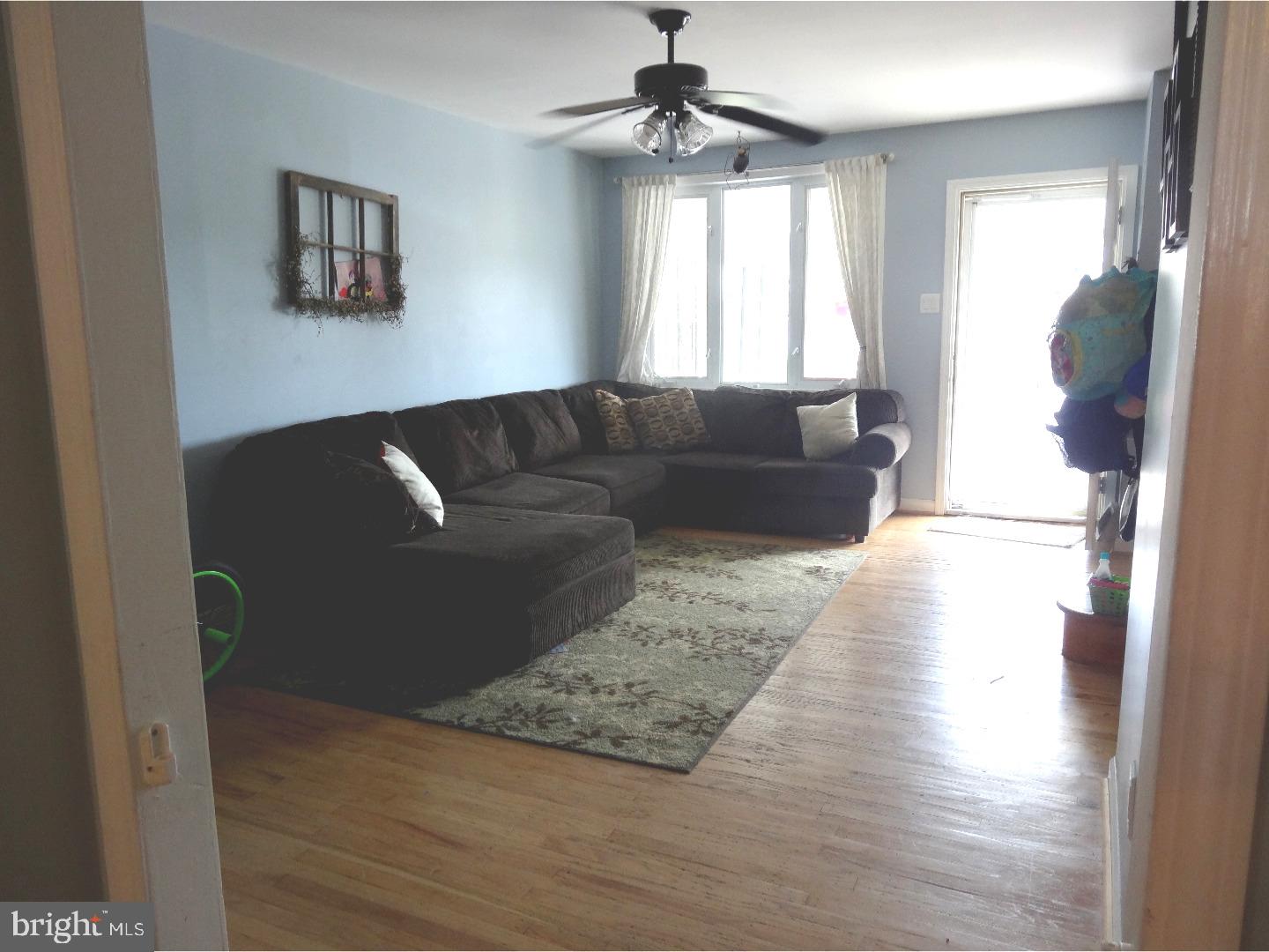 310 Ripka Street Philadelphia, PA 19128 - Photo 10 of 14 a living room with furniture and a window