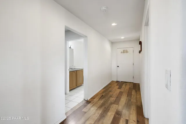 a view of a livingroom with wooden floor